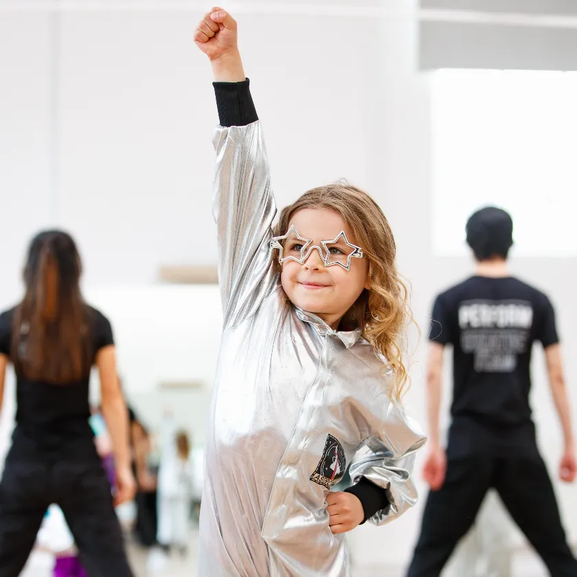 Child performing in drama class